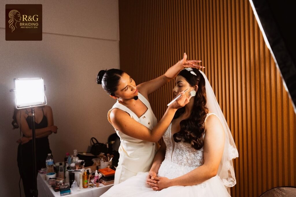 Professional makeup artist carefully applying eyeshadow to a bride during a wedding preparation session.